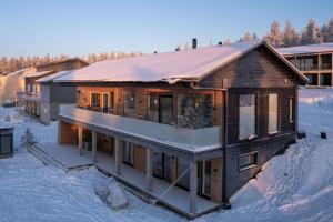 an aerial view of a house in the snow at Villa Vaalea in Rovaniemi