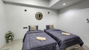 Postel nebo postele na pokoji v ubytování Irich residence South Samrong 6 Kms BTS-Pu Chao