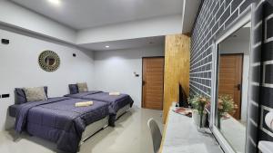 Postel nebo postele na pokoji v ubytování Irich residence South Samrong 6 Kms BTS-Pu Chao