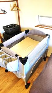 a bed sitting in a room with at B&BHOUSE FAM - Vacation STAY 39468v in Ichinomiya