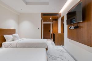 Кровать или кровати в номере Hotel Vilvah