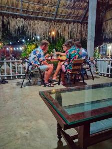 a group of people sitting at a table at Ninh Binh Bungalow Homestay in Ninh Binh