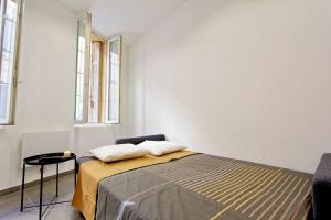 a bedroom with a bed and a chair and windows at FLC-PANIER- OLD PORT 500m - T3- 2 Bedrooms -Maxi 6 Guests in Marseille