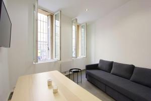 a living room with a couch and a table at FLC-PANIER- OLD PORT 500m - T3- 2 Bedrooms -Maxi 6 Guests in Marseille