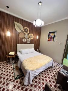 A bed or beds in a room at Bhumi Sammy by Sammy Home Yogyakarta