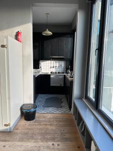 a kitchen with a door open to a kitchen with a dog bowl at Unbelievable golden horn view in Beyoglu in Istanbul