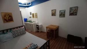 a bedroom with a bed and a sink in it at 8 JOAQUIN'S Place WIFI Free! in Antipolo +43 photos