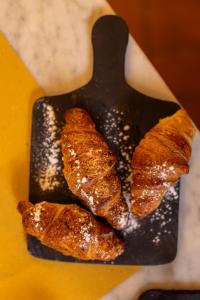 a pan with four pieces of food on it at BOUTIQUE VILLA LIBERTY - Dépendance - Borgo Capitano Collection - Albergo diffuso in San Quirico dʼOrcia