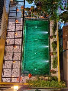 an overhead view of a green door in a building at Villa De Pi's Hoi An in Hoi An