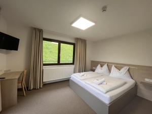 Postel nebo postele na pokoji v ubytování Hotel Stubnerhof