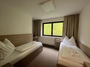Postel nebo postele na pokoji v ubytování Hotel Stubnerhof