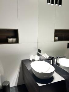 a bathroom with a large bowl sink on a counter at Kras-Resort Apartament 113 in Szklarska Poręba