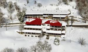 an aerial view of a building covered in snow at Chania Hotel in Chania