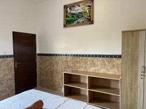 Postel nebo postele na pokoji v ubytování Leo Home Stay