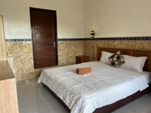 Postel nebo postele na pokoji v ubytování Leo Home Stay