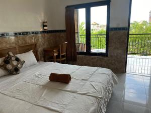 Postel nebo postele na pokoji v ubytování Leo Home Stay