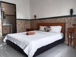 Postel nebo postele na pokoji v ubytování Leo Home Stay