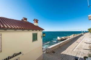 a view of the ocean from a building at Apartman Beppo in Rovinj