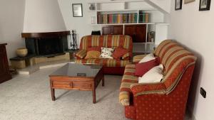 a living room with a couch and a coffee table at La Pontezuela in Chipiona