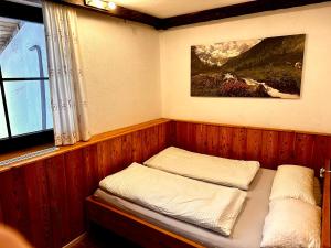 Rúm í herbergi á Fleissner Hütte