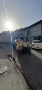 a group of people standing in a parking lot at Samarkand Сity Guest House in Samarkand