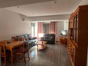 a living room with a couch and a table at Apartamento La Ermita in Chulilla