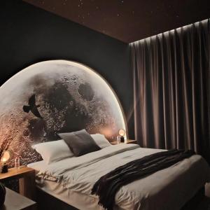 a bedroom with a large glass globe on the wall at Star Room in Ras al Khaimah