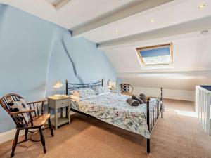 a bedroom with a bed and a desk and a chair at 3 Bed in Baslow PK908 in Baslow