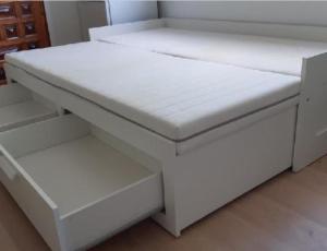a white bed with two drawers in a room at Centro Lugo in Lugo