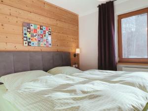 Voodi või voodid majutusasutuse Appartements Skida toas