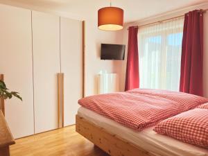 Voodi või voodid majutusasutuse Appartements Skida toas