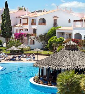 a resort with a swimming pool and a building at Fantastic sea and golf course view house with 3 bedrooms in San Miguel de Abona