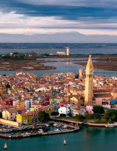 an aerial view of a city next to the water at Cà Comare Burano in Burano