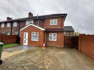a brick house with a driveway in front of it at Double Room With Free WiFi Keedonwood Road in Bromley