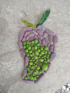 a bunch of green fruit in the shape of a heart at Pinwheel Retreat in Lansdowne