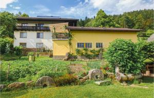 a house with a garden in front of it at Nice Home In Klein St, Paul With Kitchen in Eberstein