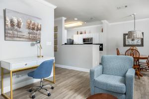 a living room with a desk and a chair at Park Avenue 109 in Foley