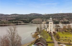 an aerial view of a building next to a lake at Gorgeous Home In Grsmark With Wifi in Gräsmark