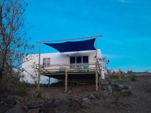 a house with a blue cover on top of it at Blue View Terrace in Rodrigues Island