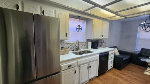 a kitchen with a stainless steel refrigerator at Family Home in Oklahoma City