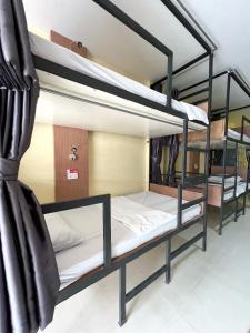 a group of bunk beds in a room at Hangover Aonang in Ao Nang Beach