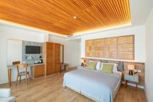 a bedroom with a bed with a wooden ceiling at EPHESUS RETREAT in İzmir
