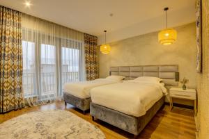 Olimp Hotel客房内的一张或多张床位