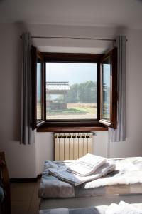Postel nebo postele na pokoji v ubytování Cascina Pirondini