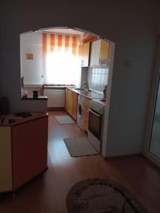 a kitchen with a sink and a stove top oven at SilviaHouse in Alba Iulia +2 photos