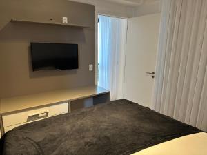 TV a/nebo společenská místnost v ubytování Mundial Hotel & Flat SSA