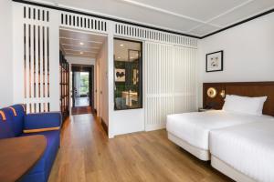 Postel nebo postele na pokoji v ubytování Hotel Tres Reyes San Sebastián