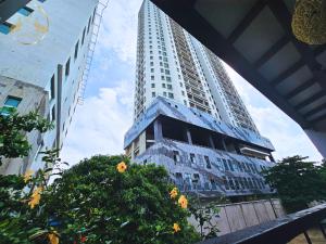 a view of two tall buildings in a city at Galle Face Terrace Hostel by Tourlux in Colombo