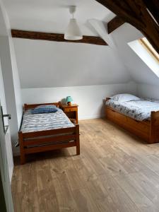 Postel nebo postele na pokoji v ubytování T3 en duplex logement entier