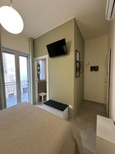 TV a/nebo společenská místnost v ubytování Muralta Suite & Luxury Rooms